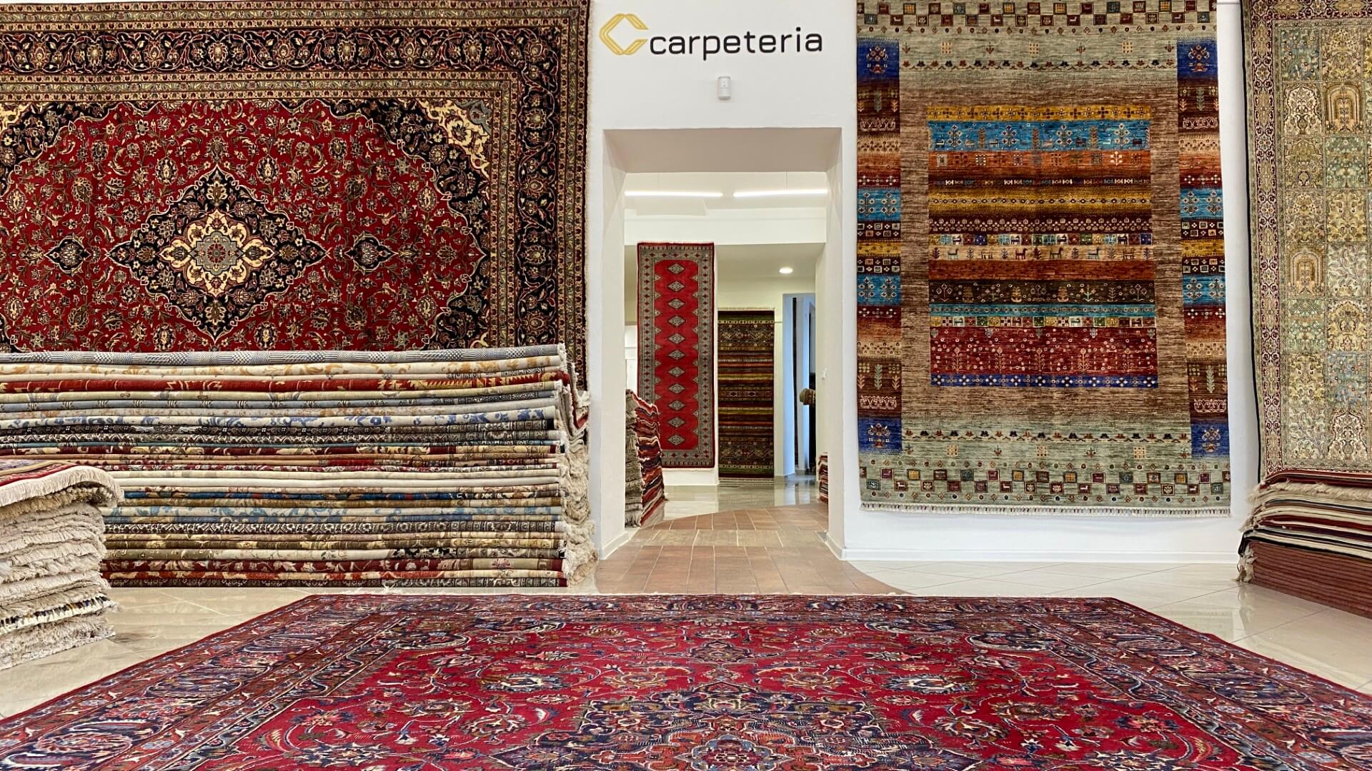 The real interior of Carpeteria's extensive showroom filled with hand-knotted rugs